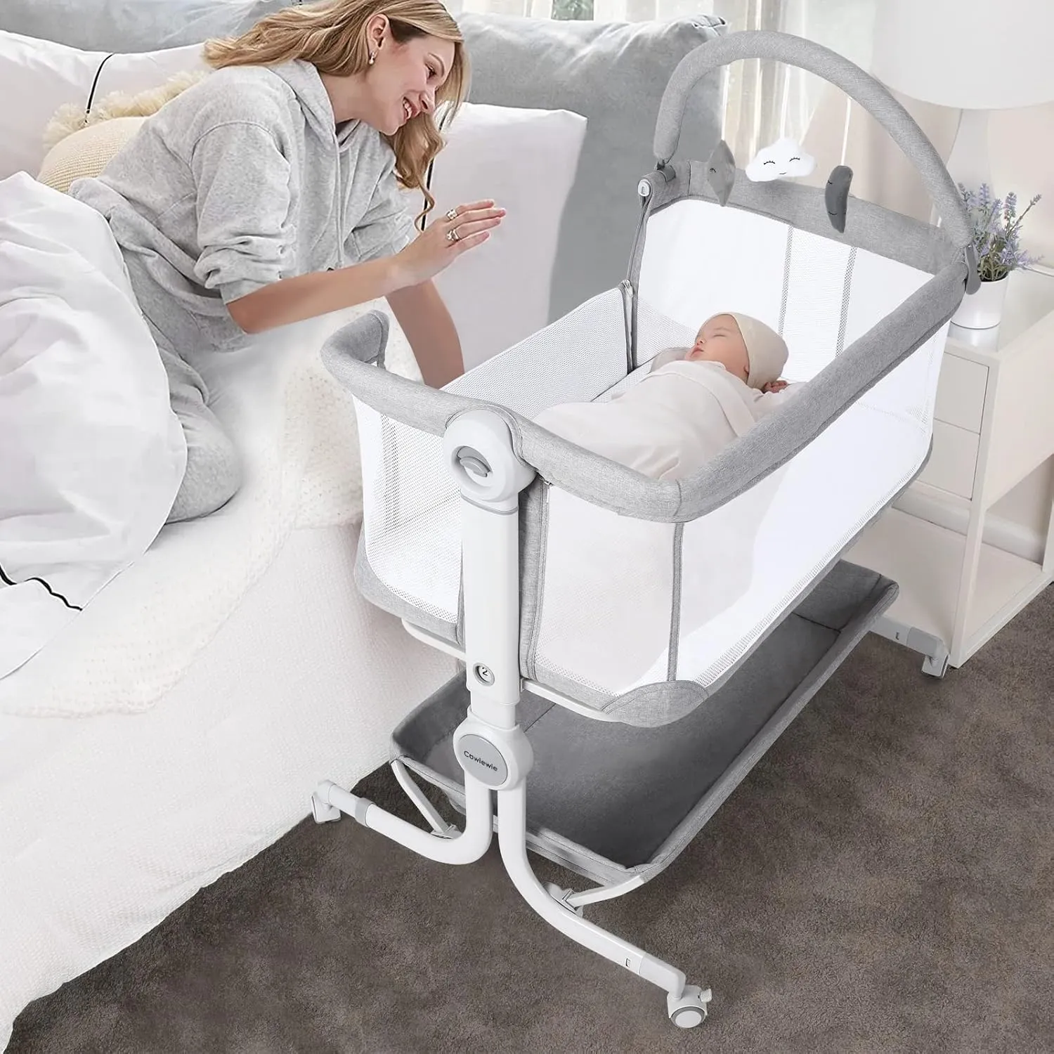 Cowiewie Baby Bassinet Bedside Sleeper with Storage Basket,Wheels and Toys, Easy Folding Portable Bassinet with Wheels Adjustable Height Portable Bassinets for Newborn